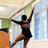 Student performer at a women's history event